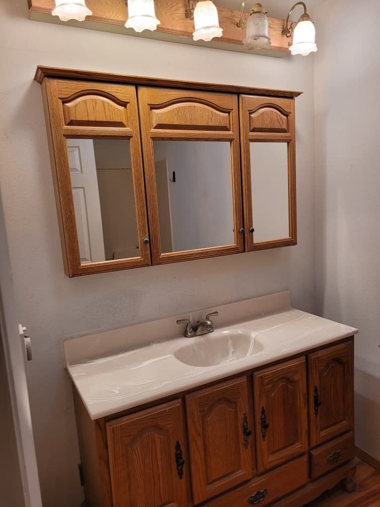 The dated vanity before the remodel