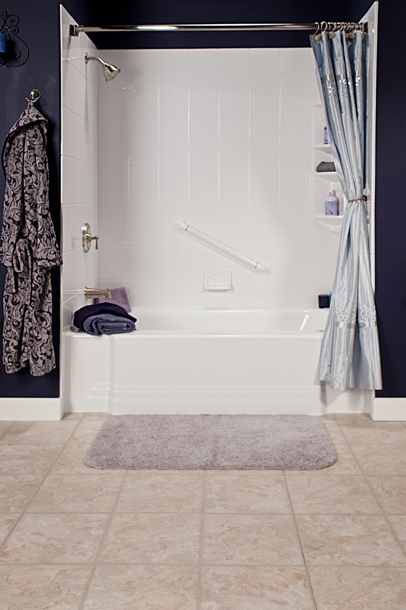 Classic white tub and walls with brushed nickel fixtures