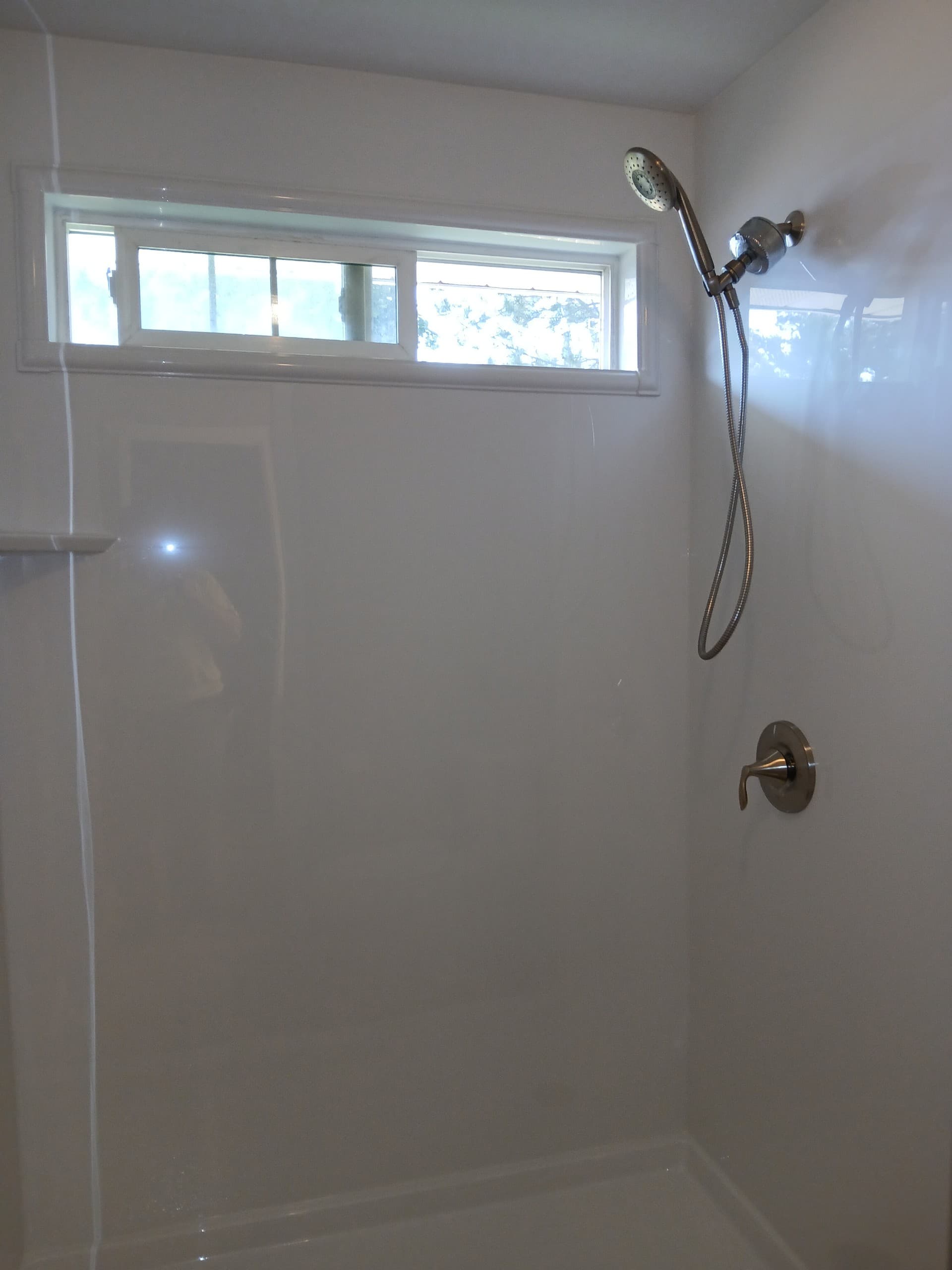 Tall walk-in shower with rainfall head in Nampa