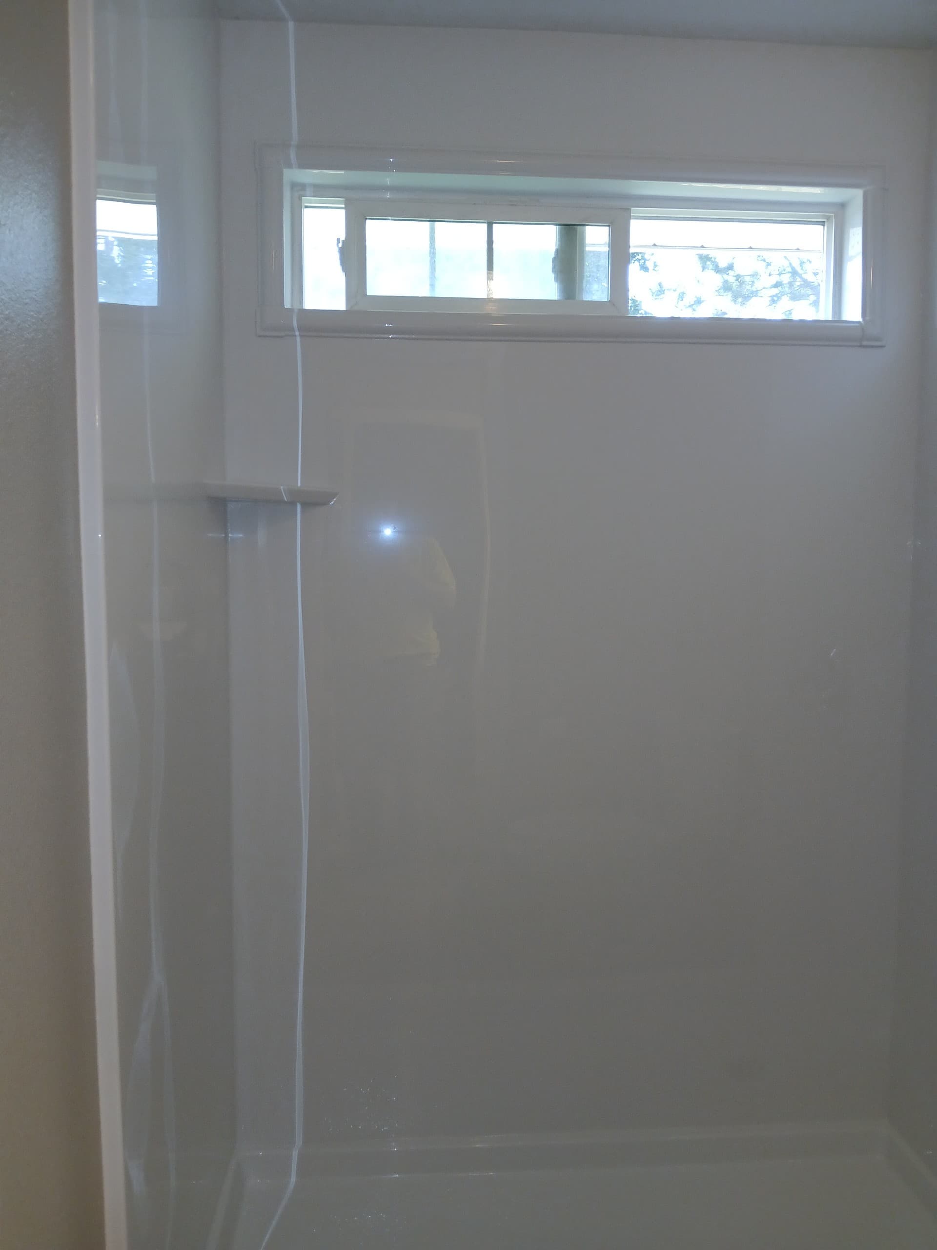 Custom tile walk-in shower built by the Kingdom Vision crew